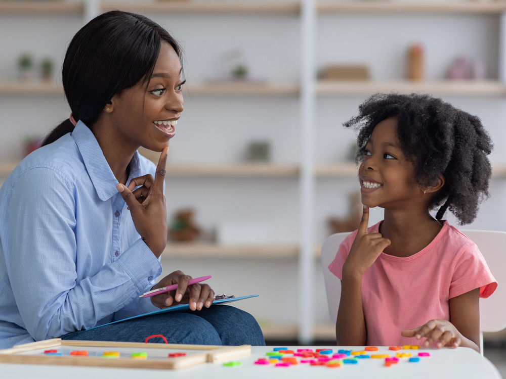 Speech-language pathologist completing a child speech evaluation with a young girl at Optimum Speech in Apple Valley, CA